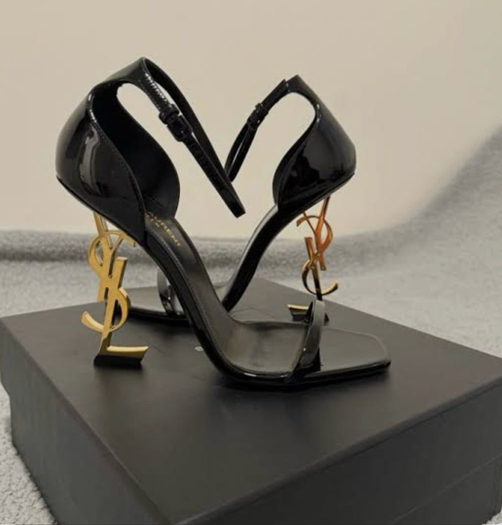 Elegant black high heel sandals with gold logo heels from the Women's Shoes Collection