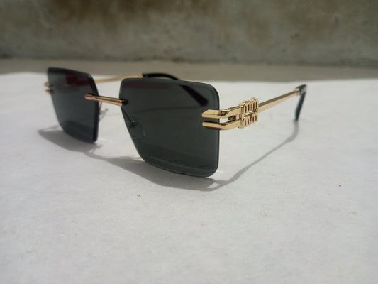 Rash Enterprise Cartier Sunglasses with square dark lenses and gold decorative temples