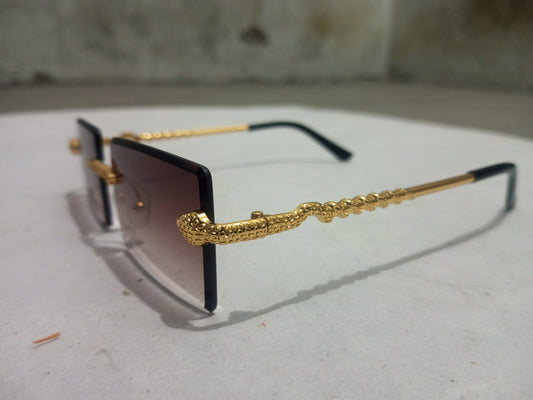 Rash Enterprise Cobra Shades with black lenses and gold snake detail on arms